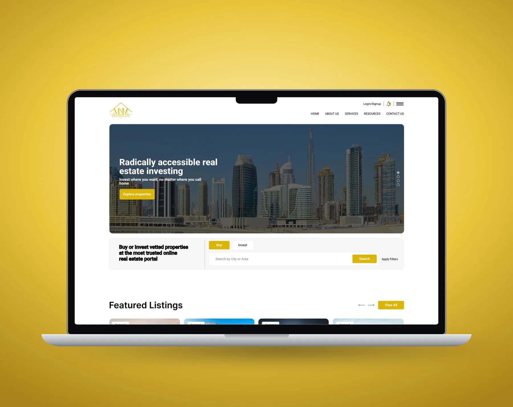 MNM Estates landing page on a laptop